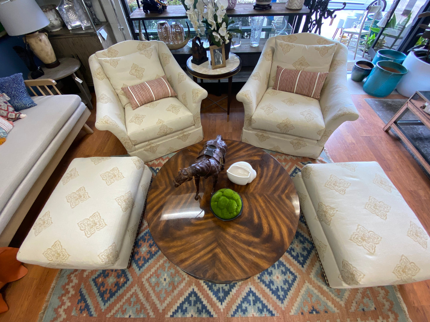 Pair of beige club chairs w/ottomans w/fleur de lis detail