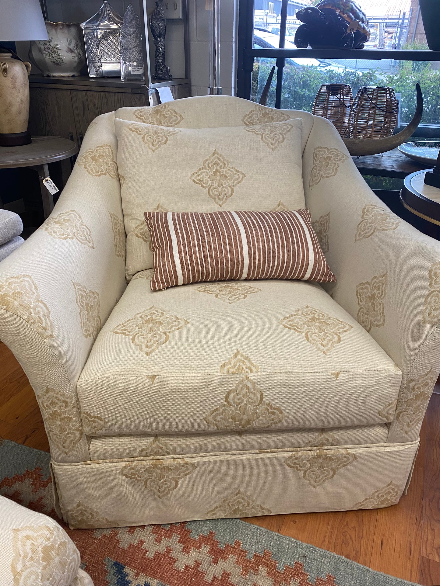 Pair of beige club chairs w/ottomans w/fleur de lis detail